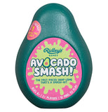 This green plastic box is shaped like an avocado with a picture of a green splatter against a pink background. The words, "Ridley's Avocado Smash" are shown in green and white lettering. A pink sticker with the words, "Fun n' Ready For All The Family" in white lettering is shown to the left.
