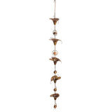 Flamed calla lily garden ornament with copper bells in between each lily.