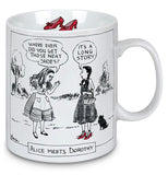 This white mug features an image of Alice from "Alice in Wonderland" meeting Dorothy and her dog Toto from "The Wizard of Oz". Below the rim, inside the cup, is a picture of the ruby slippers.