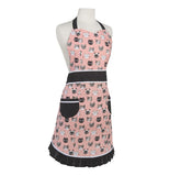 This pink apron has brown outlines and different cats on it.