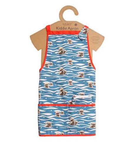 The blue, red, and white apron with the baby sea otters is shown wrapped around the cardboard body cutout.