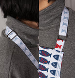 This apron features red and white and blue fish over a white background.