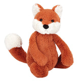 This is an adorable stuffed orange and white fox in a sitting position.