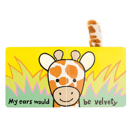 The book is shown open to two pages showing a giraffe's face sticking above grass. The words, "My ears would be velvety" are written across the bottoms of both pages in black lettering.