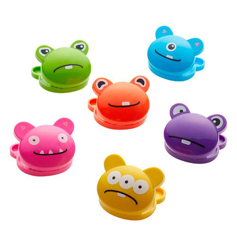 These bag clips are shaped like the heads of different colored monsters. The first is green, the second is light blue, the third is purple, the fourth is orange, the fifth is magenta, and the sixth is yellow.