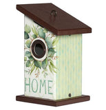 This cream colored birdhouse with a brown roof and floor sports a design of eucalyptus leaves surrounding the opening. Below the leaves is the word, "Home" in turquoise lettering.