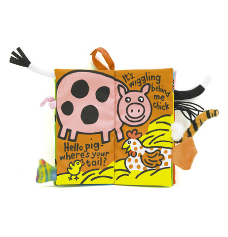 The "Farm Tails" Activity Book is open to a page with a pig on one page, a chicken with a baby chick on the other.