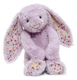 Stuffed Bunny that is purple and has pink and purple flowers on ears and feet