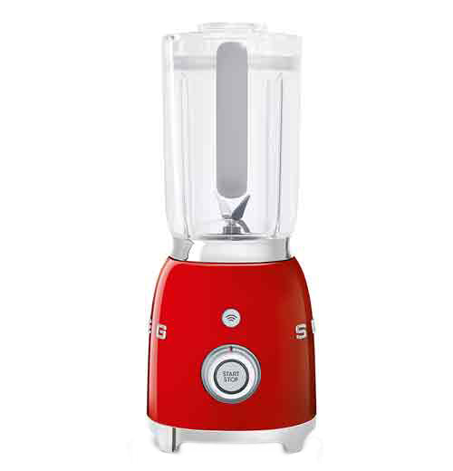 A blender with a red base is on its&