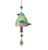 This copper bell has a ceramic bottom that looks like a green hummingbird with teal and magenta wings and a black tail. A copper leaf sculpture hangs at the bottom.