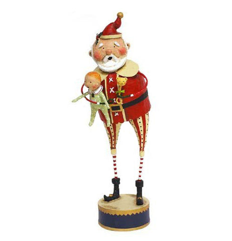 This Christmas figurine is of a Santa Claus character holding a baby in green pajamas.