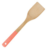 Bamboo spatula with orange handle.