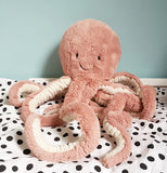 This "Odell Octopus" lays on sort of a bed. 