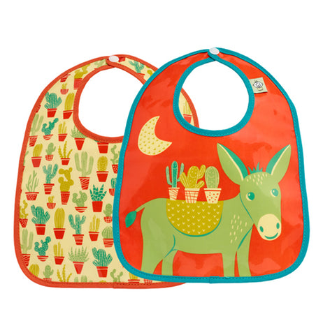 Two desert themed bibs that are brightly colored. One featuring many potted cacti covering the entire bib, the other of a green burro under the moon carrying cacti.   