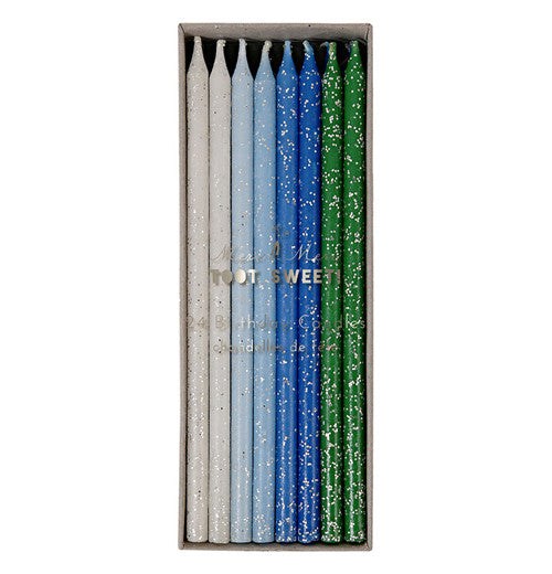 Set of 12 birthday candles in green, blue and white.
