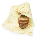 Food Wrap is large enough to cover the loaf of bread over a white background.