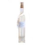 Bubble bath is a tall white bottle with a white ribbon around the bottle says "Lollia Breathe."