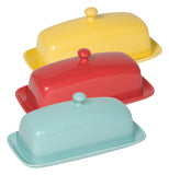 Wll three variants of this butter dish are shown, the eggshell in front, red in the middle, and lemon yellow in back, all are two pieces with a round knob on top of the cover.