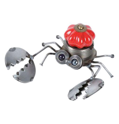 This is a metal sculpture of a crab with a red doorknob in its middle to make up its shell. The crab&