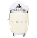 this cream juicer shows its logo SMEG. The top is clear and shows the citrus grinder. There is a spout of the left side.