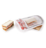 The half of the sandwich inside the opened the Zipper Bag Jam Jar with the half of the sandwich taken out. 