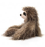 This view shows the sloth sitting down from the side.