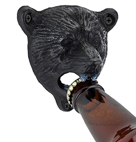 Bottle opener in the shape of a black bear head being used to open a beer bottle.