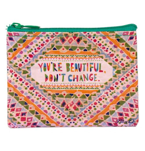 Coin purse with many bright colors such as pink, orange, navy blue etc. There are many geometric designs and a green zipper.