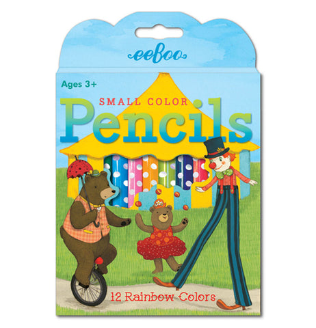 This box of colored pencils depicts two circus bears and a clown with long legs performing on a unicycle and doing leg work in front of a yellow circus tent. An opening in the box shows the different polka dotted colored pencils. 