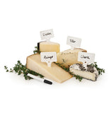 White markers in use on various cheese.