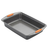A gray baking dish with small orange rubber pads on the handles.