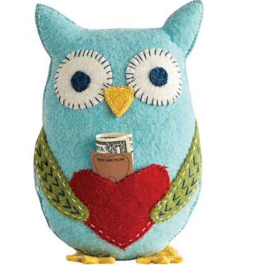 A blue felt owl has green wings, yellow feet and red heart in the middle. A piece of paper with the words "tooth fairy pillow" and a dollar bill stick out.