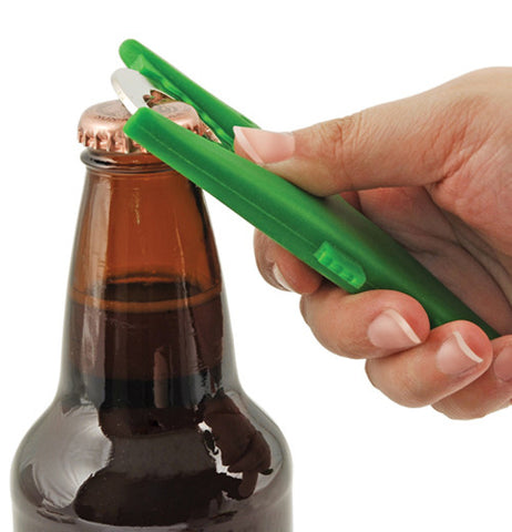 Bottle opener that looks like a green crocodile being used.d.