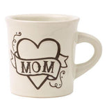 The white mug has a heart with mom written on a ribbon wrapped around the heart