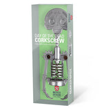 The skeleton-shaped corkscrew is shown in its gray and green packaging.