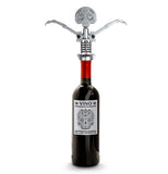 The skeleton-shaped corkscrew is shown opening a wine bottle.