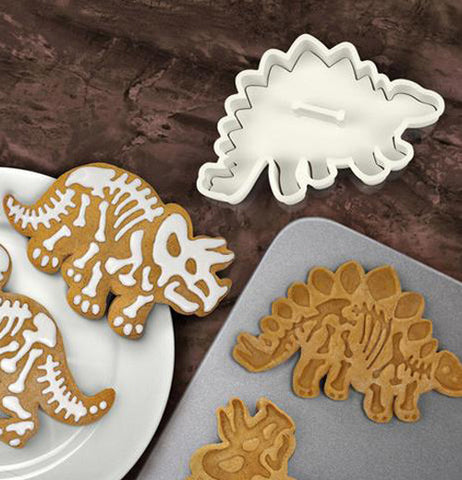 Dinosaur shaped cookie cutter and the cookies made from them.