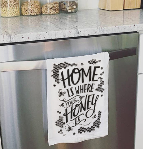 Dish towel over the handle of the oven door.