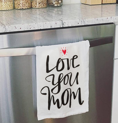 Love you mom dish towel hanging on the oven door.