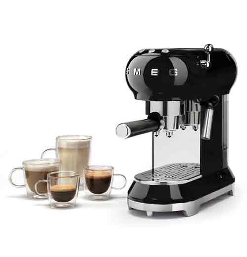 A black expresso machine with 4 glass cups next to it filled with coffee.
