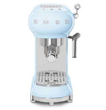 A light blue expresso machine with the words SMEG on it.
