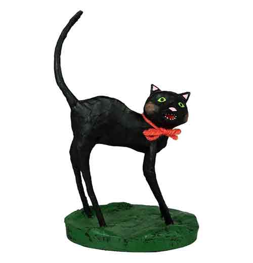 This figurine is of a black cat with a red bow tie around its neck.