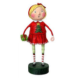 This figurine is of a girl dressed in red and green with a red skirt holding a present wrapped in green paper. A red bowtie is wrapped around her blonde hair.