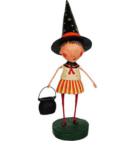 A polyresin figure of a young girl wearing a pointy black witches hat with a red ribbon around it, a navy blue, red, white, orange, and yellow sailor dress, red stockings, and black Mary Jane shoes. She holds a "cauldron" bucket. The girl  appears to be caucasian, with rosy cheeks, and black bangs.