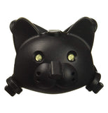 This black bicycle light is shaped like a cat's head, complete with ears, nose, eyes and mouth.