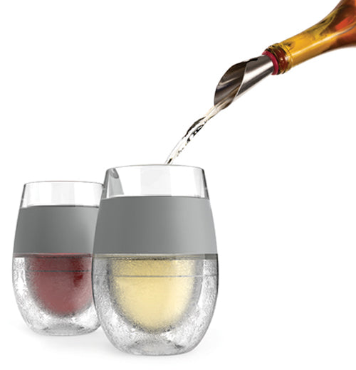 A beverage is shown being poured into the glasses. 