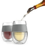 A beverage is shown being poured into the glasses. 
