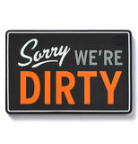 A magnet sign saying "Sorry we're dirty." 