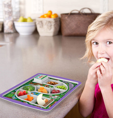 Purple game board plate with different types of food in each slot and a girl to the side eating one of its may treats.