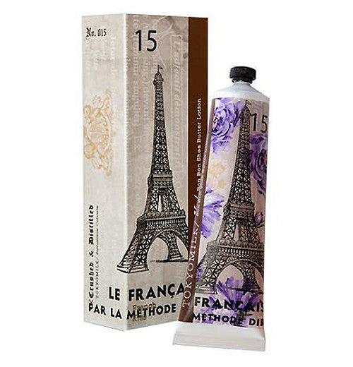 Shea Butter Lotion with the Eiffel tower illustrated on it. The lotion is placed next to it&